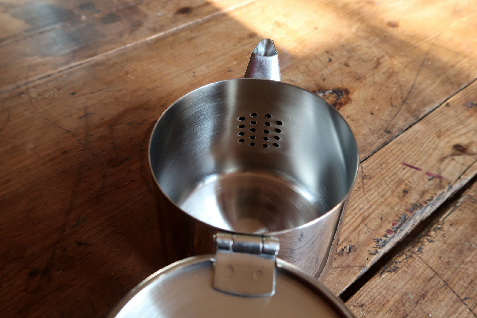 Minimalist tea kettle top view, lid and handle in industrial style