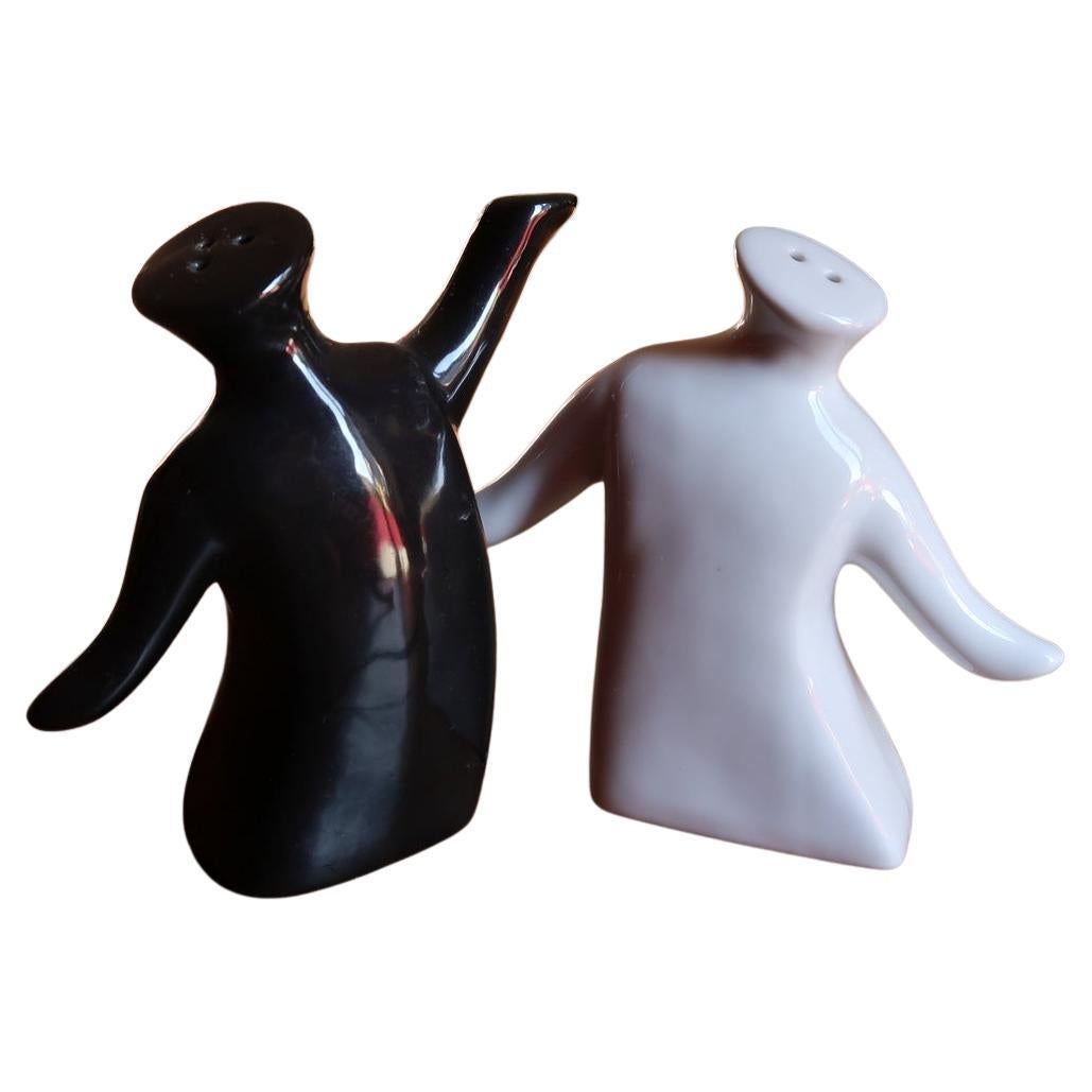 Modern ceramic salt and pepper shakers, anthropomorphic black and white design