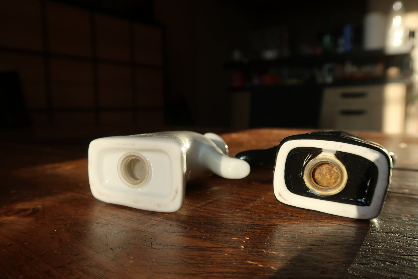 Ceramic salt and pepper shakers close-up, smooth glaze and minimalist design