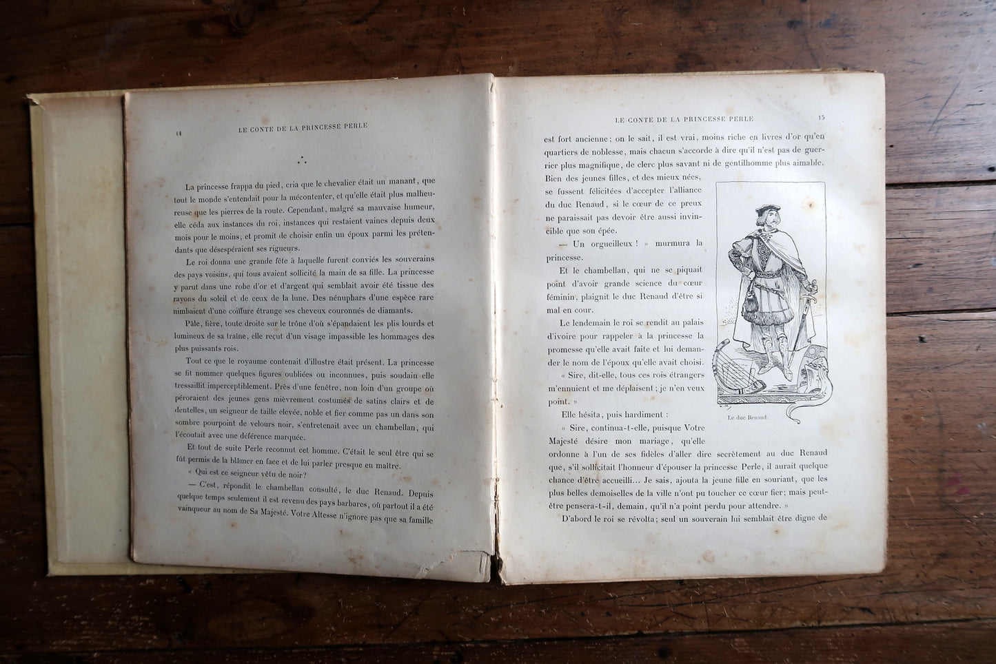 Antique illustrated book detail, black and white drawings and typography