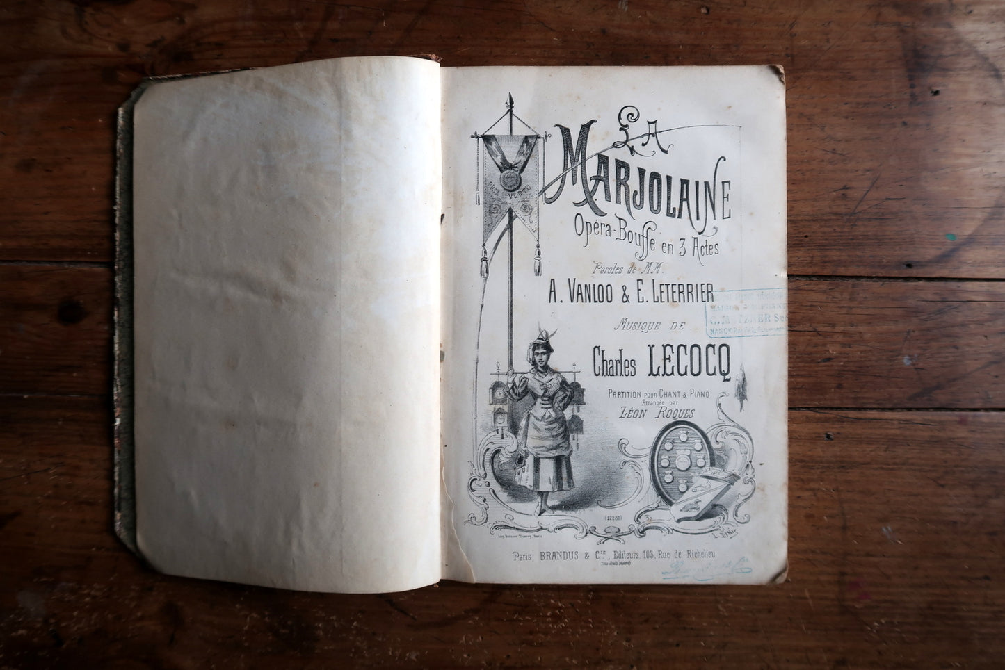 French opera sheet music close-up, showing vintage print and musical notation