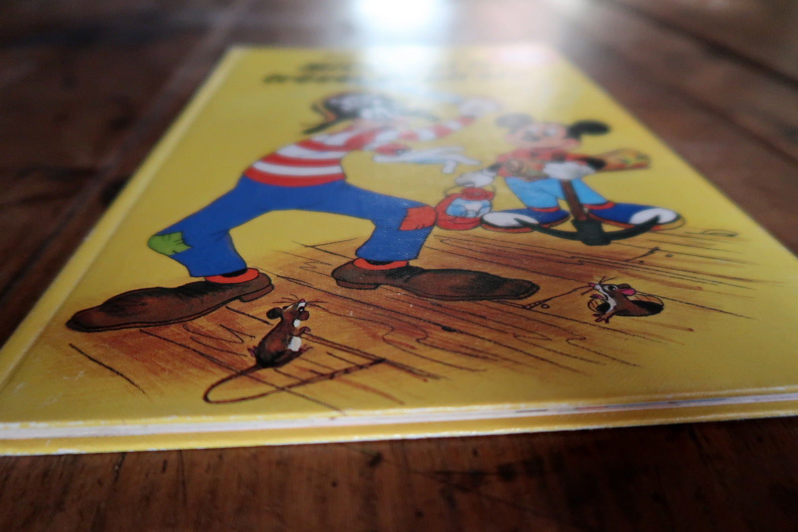 Mickey Mouse book corner detail, showing light wear and vintage condition
