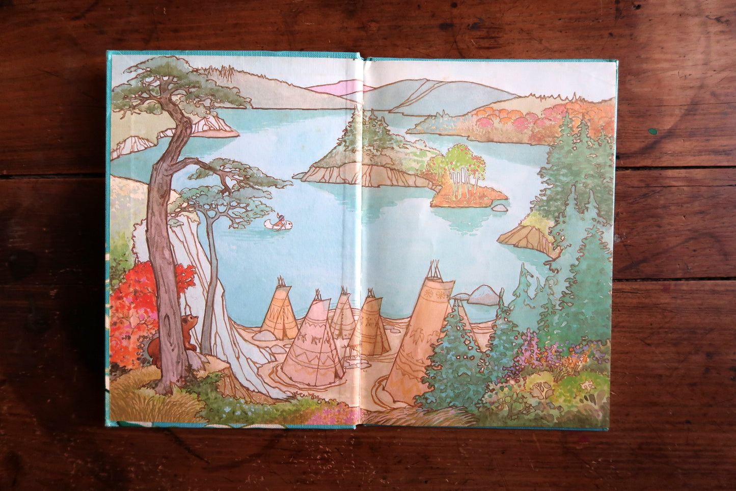 Vintage Disney book detail, Hiawatha character in forest scene with animals