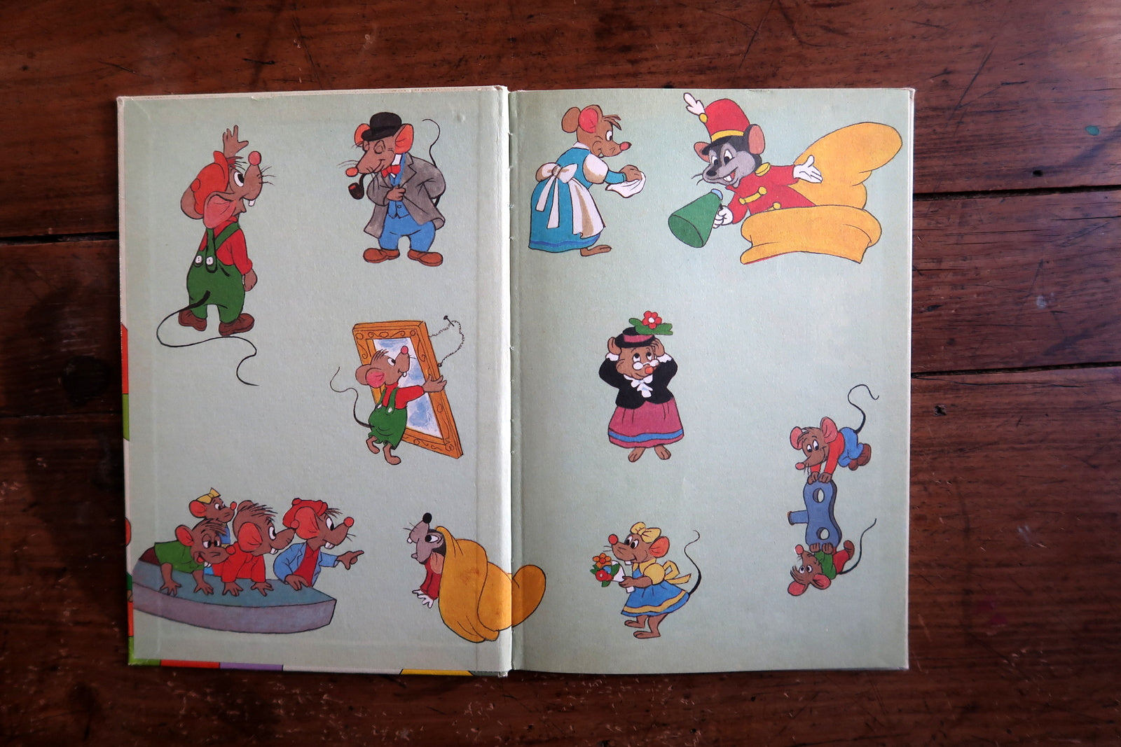 Vintage Disney book detail, playful mice exploring circus world