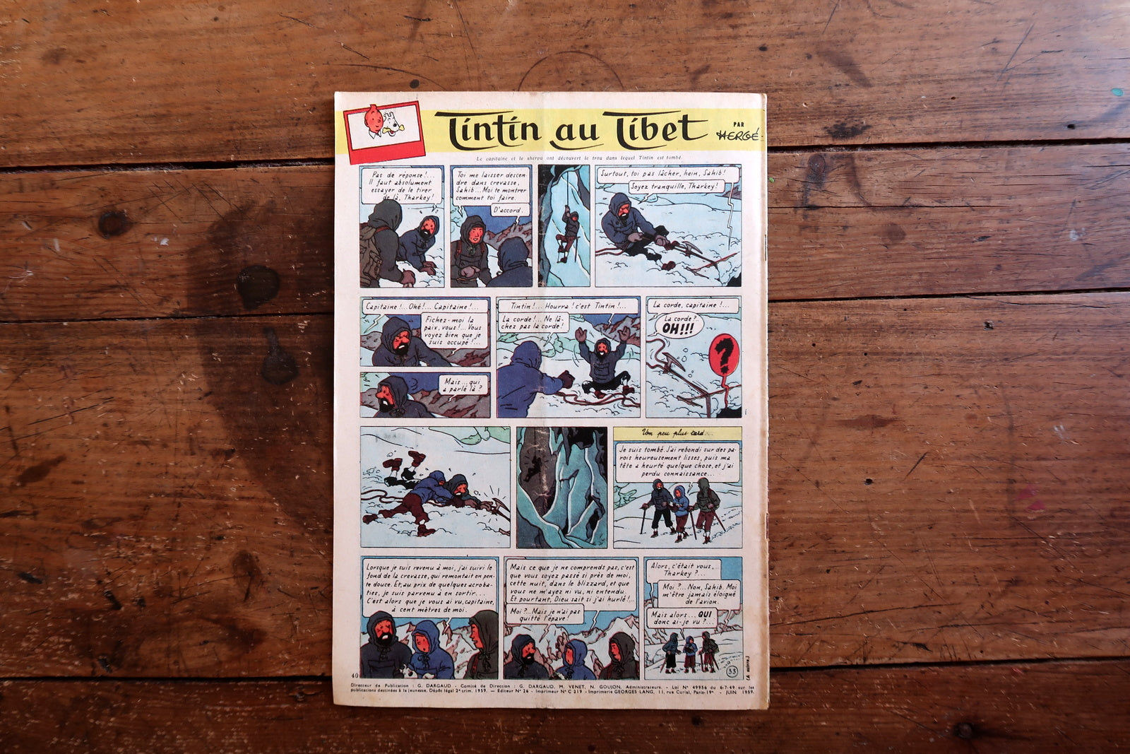 Interior page spread from vintage Tintin magazine issue 555 June 1959 showing black and white comic strip artwork from the Hergé era.

