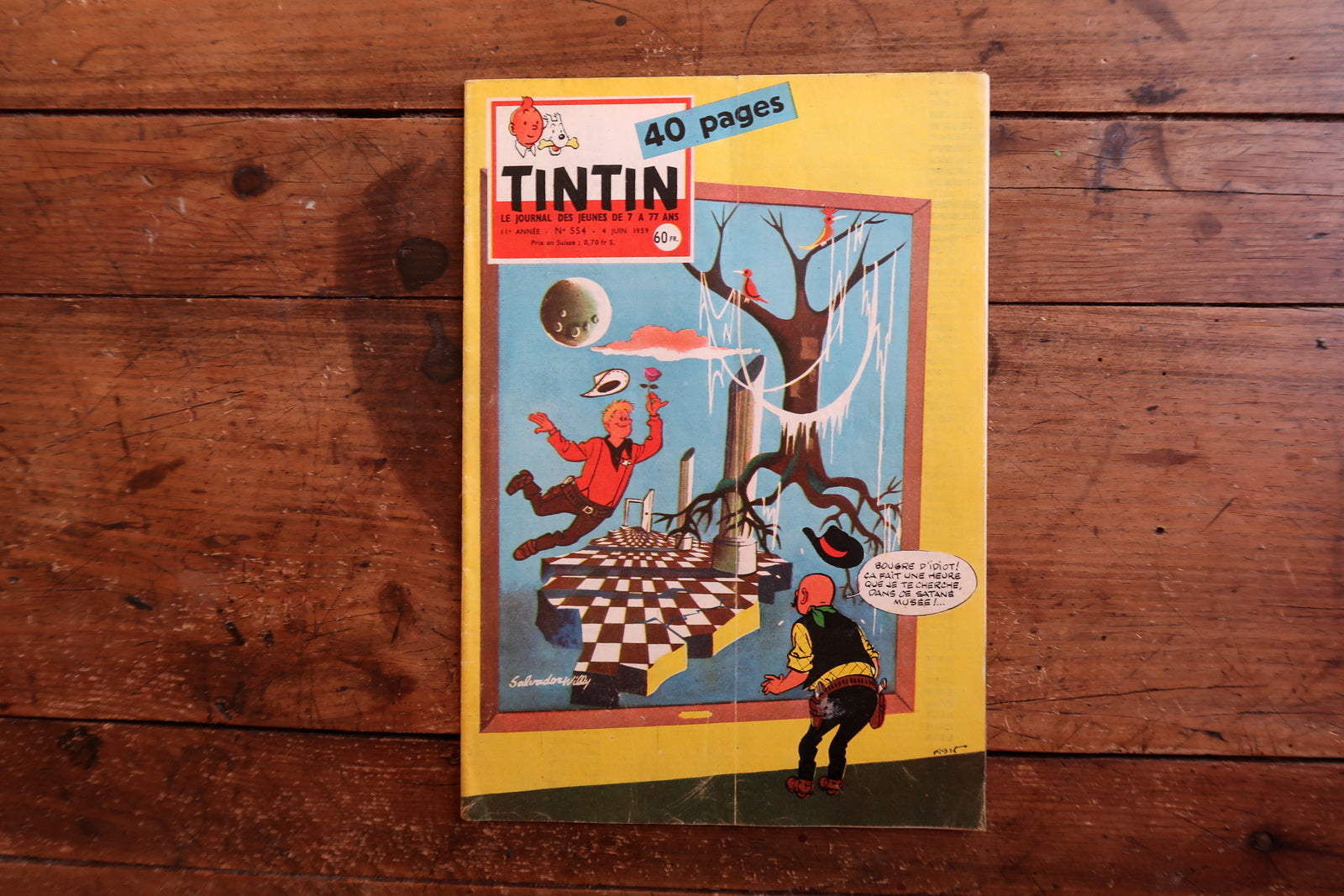 Front cover close-up of original 1959 Tintin magazine issue 554 showing highly distinctive artistic cover with surrealist imagery and mid-century modern illustration style.


