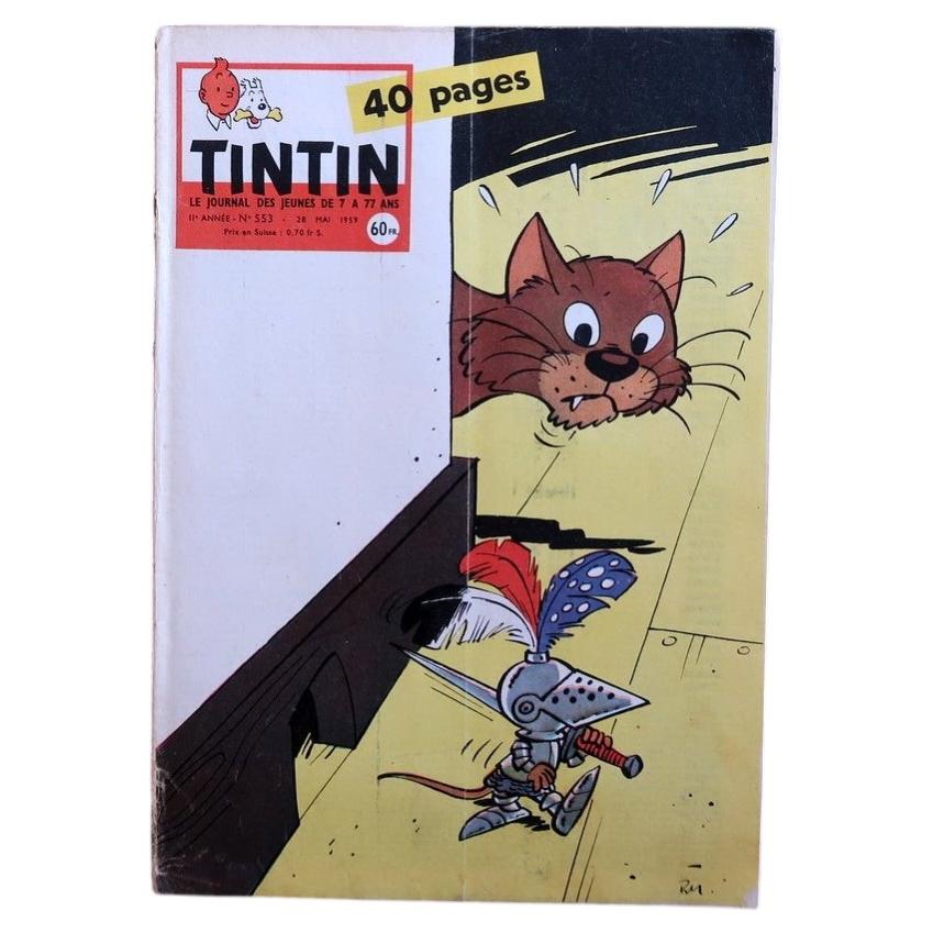 Vintage Tintin magazine No. 553 from May 1959, French comic journal from the Hergé era, featuring a playful cover of an armored character confronted by a cat in bold mid-century graphic style.

