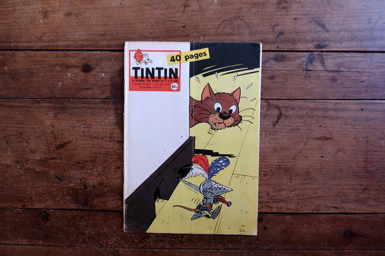 Authentic 1959 issue of Tintin magazine, No. 553, published by Le Lombard, measuring approximately 8.3 by 11.8 inches, with a striking and humorous cover illustration.

