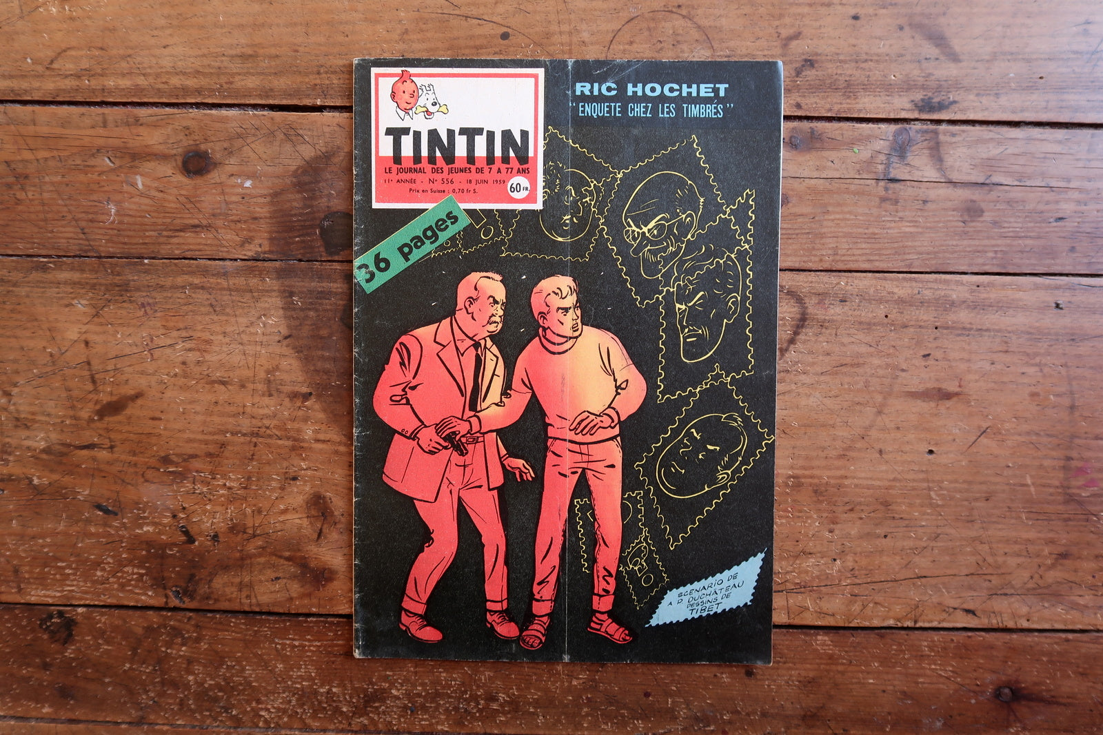 Authentic June 1959 issue of Tintin magazine, No. 556, published by Le Lombard, featuring Ric Hochet detective story with the investigative theme "Enquête chez les timbrés."

