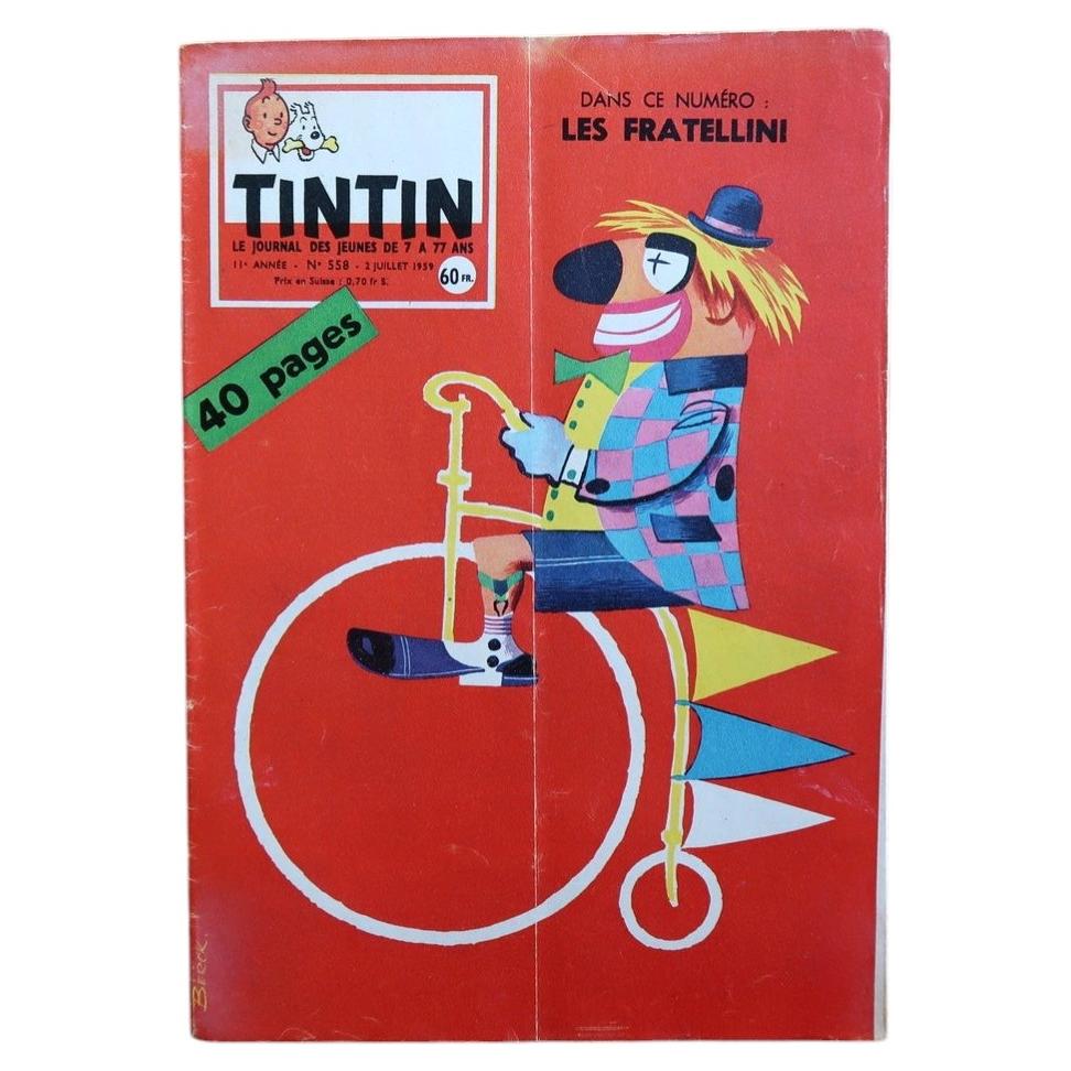 Vintage Tintin magazine No. 558 from July 1959, French comic journal featuring a striking circus-themed cover with a stylized clown riding a penny-farthing bicycle on a bold red background.

