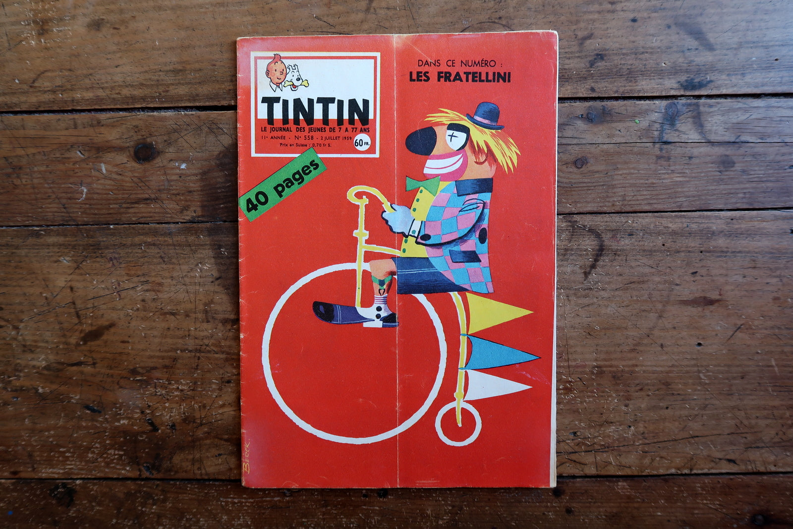 1959 Tintin magazine No. 558, French comic journal from the Hergé era, measuring approximately 8.3 by 11.8 inches, with a highly decorative clown and penny-farthing cover.

