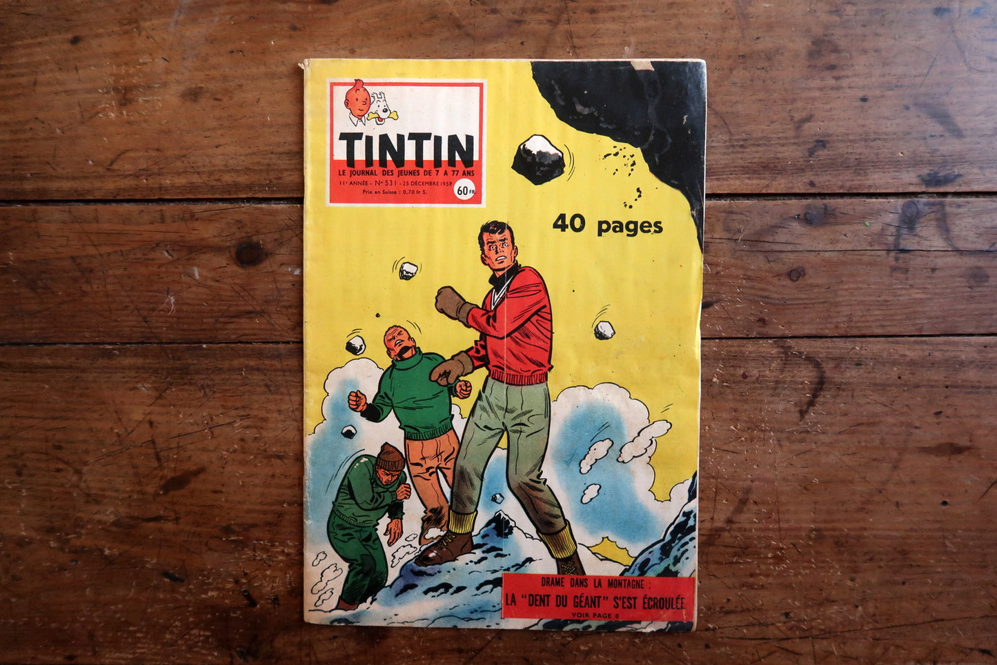 Vintage December 1958 Tintin magazine issue No. 531 displayed flat, measuring approximately 10.6 x 7.9 inches, with French language text and bande dessinée artwork.

