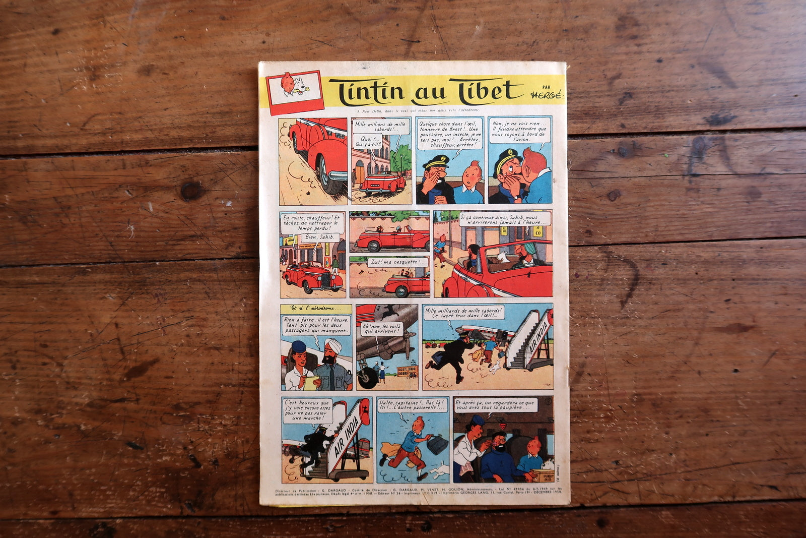 Collectible 1958 Tintin magazine from the golden era of European comics, featuring an adventure-themed cover and interior pages from Tintin au Tibet by Hergé.

