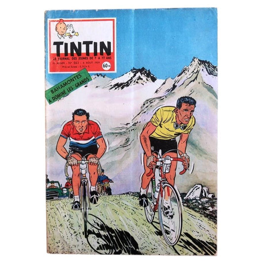 Front cover of vintage Tintin magazine No. 563 from August 1959 featuring a dynamic cycling-themed illustration of two racing cyclists climbing a mountain pass, evoking the Tour de France era.

