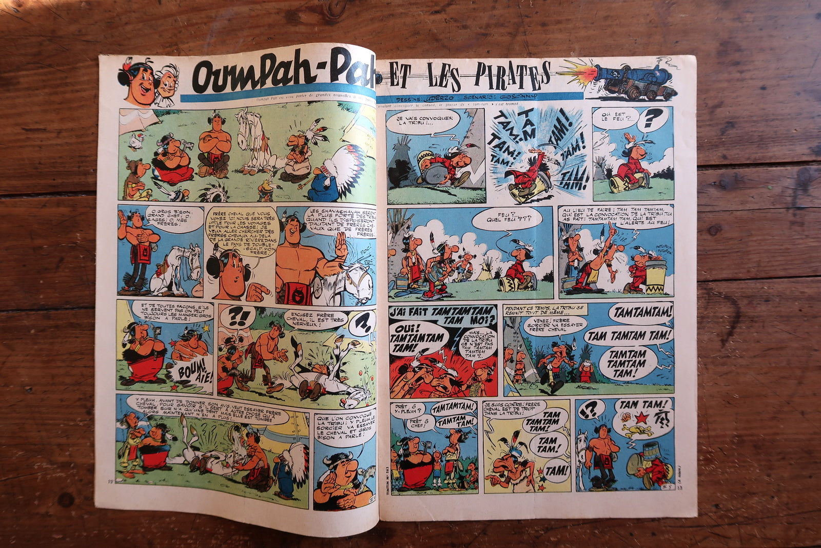 Open view of vintage Tintin magazine No. 563 showing interior comic strips including Oumpah-Pah by Uderzo & Goscinny, Modeste et Pompon, and period articles.

