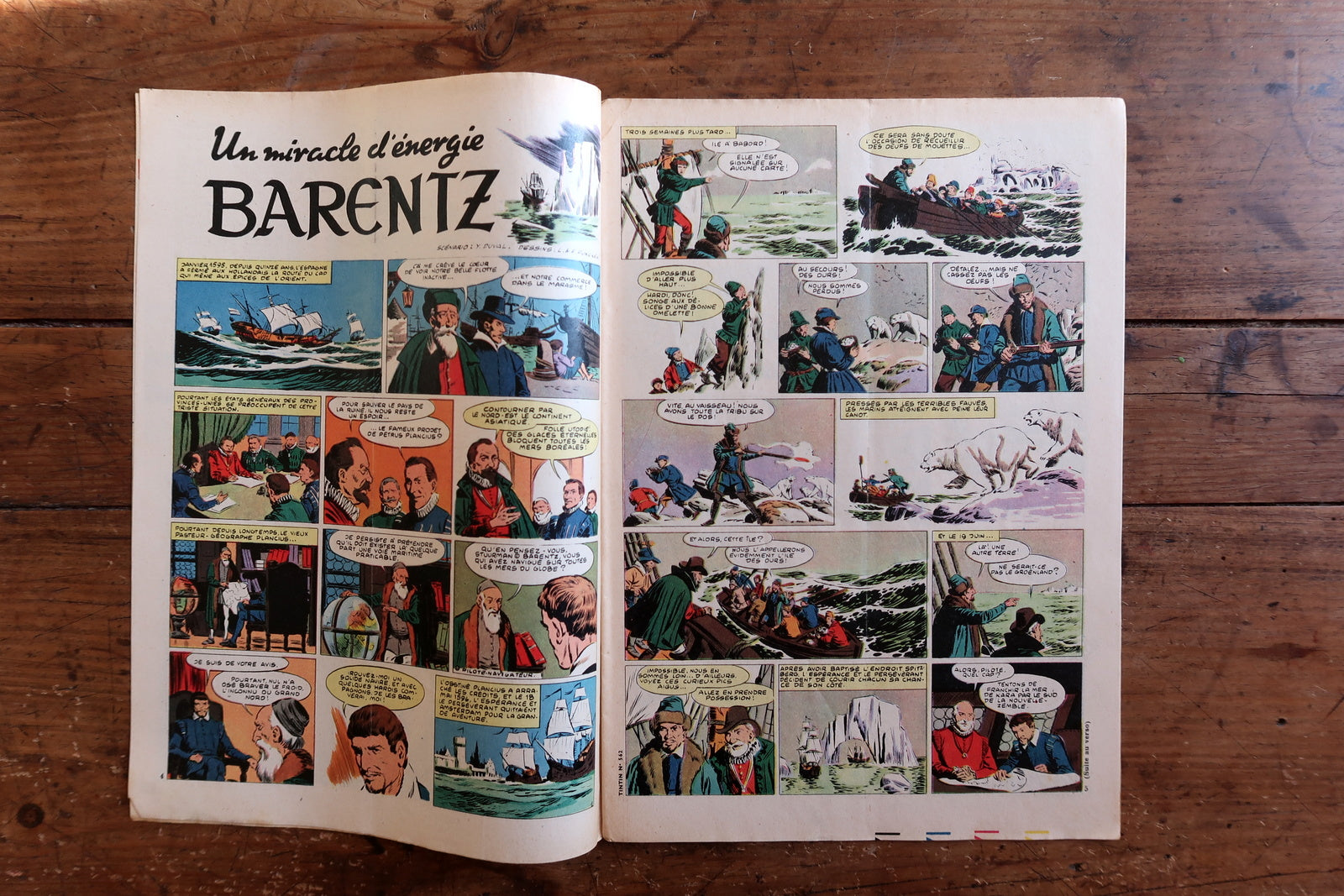 Open view of original Tintin magazine No. 562 showing interior comic strips, illustrated stories, advertisements, and editorial content typical of late 1950s Franco-Belgian comic culture.

