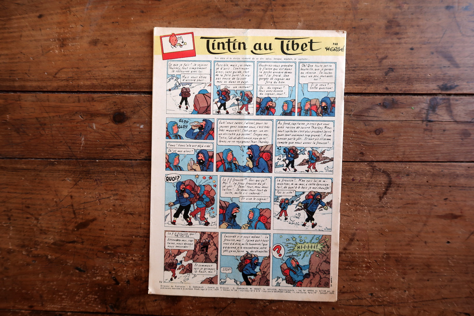 Collectible 1959 Le Journal de Tintin magazine from the golden age of Franco-Belgian comics, featuring a Western-themed cover and interior pages including Tintin au Tibet by Hergé.

