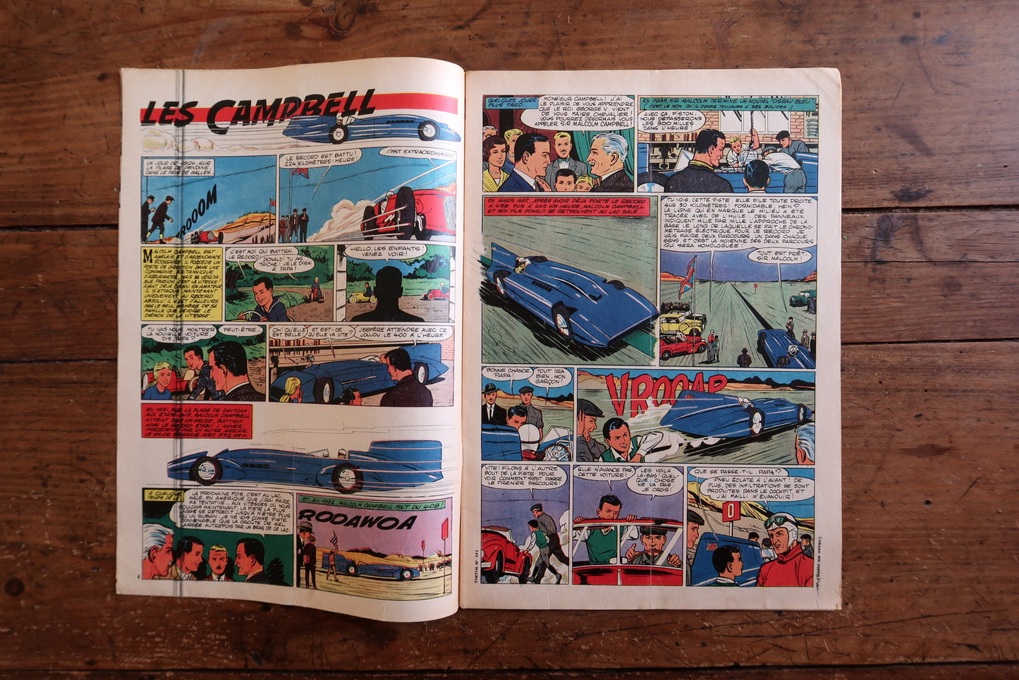 Open view of original Tintin magazine No. 542 showing interior comic strips including Les Campbell and Michel Vaillant (racing-themed stories), aviation features, games, and editorial content.

