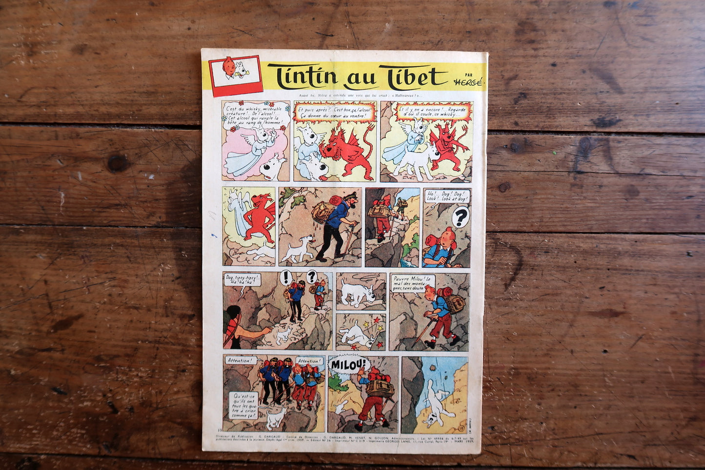 Collectible 1959 Le Journal de Tintin magazine from the golden age of Franco-Belgian comics, featuring a dramatic maritime cover and interior pages including Tintin au Tibet by Hergé.

