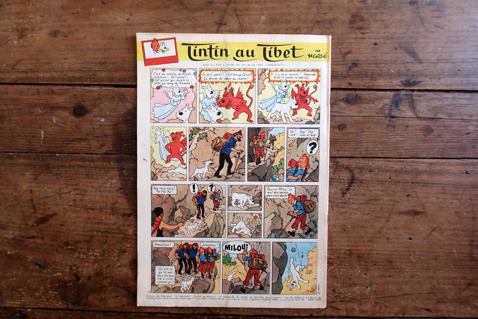 Collectible 1959 Le Journal de Tintin magazine from the golden age of Franco-Belgian comics, featuring a dramatic maritime cover and interior pages including Tintin au Tibet by Hergé.

