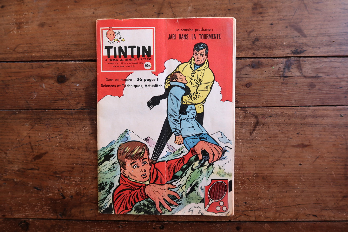 Vintage October 2, 1958 Tintin magazine issue N°519 displayed flat, measuring approximately 8.3 x 11.8 inches, with French language text and bande dessinée artwork.

