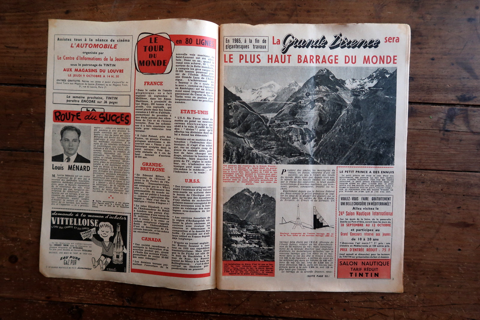 Open view of original Tintin magazine N°519 showing interior pages including La Cavale d'Or by Willy Vandersteen, Sciences et Actualités feature on the Vespa 400 microcar, and a world news spread on La Grande Dixence dam construction.

