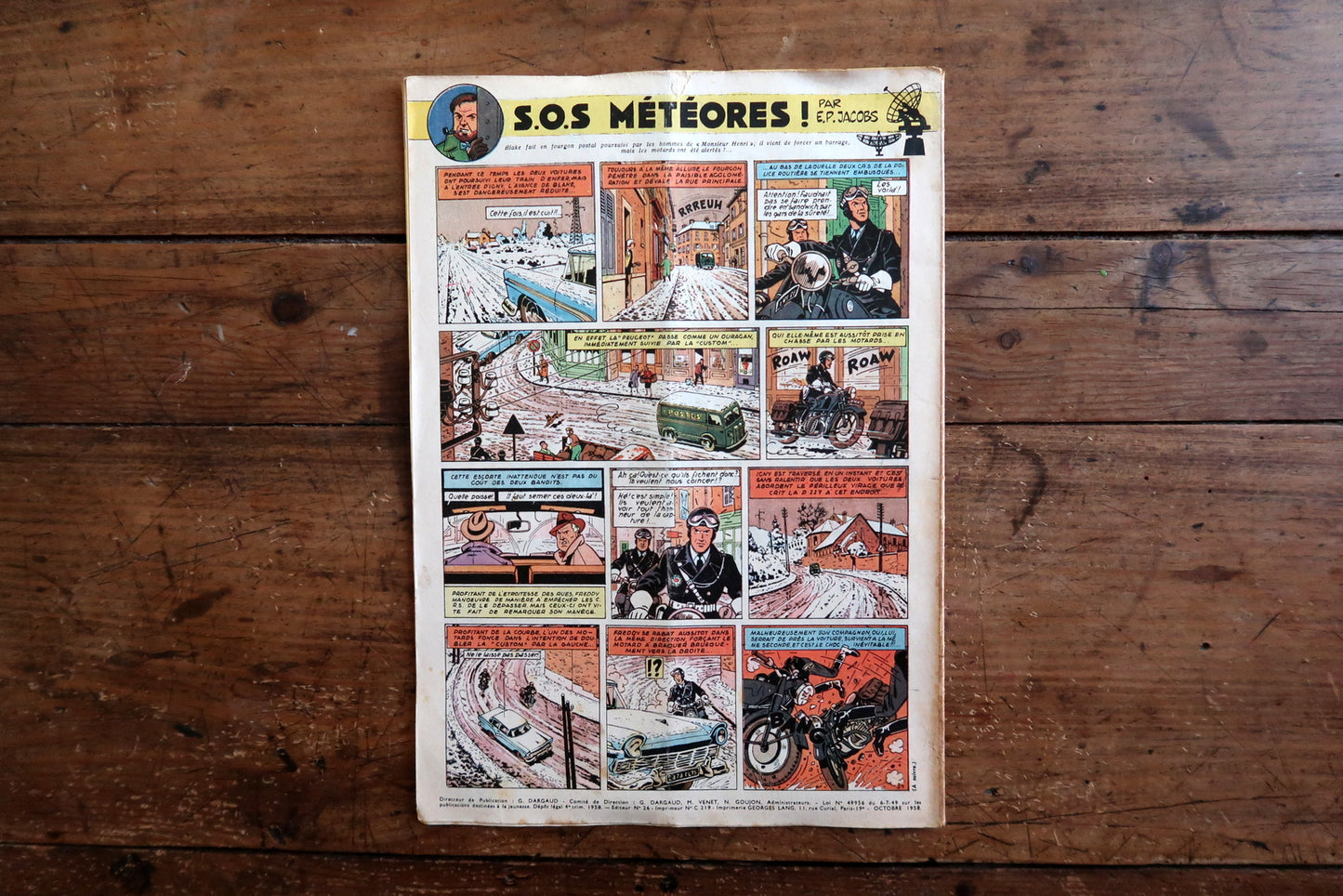 Vintage October 9, 1958 Tintin magazine issue N°520 displayed flat, measuring approximately 8.3 x 11.8 inches, with French language text and bande dessinée artwork, showing a visible vertical cover fold.

