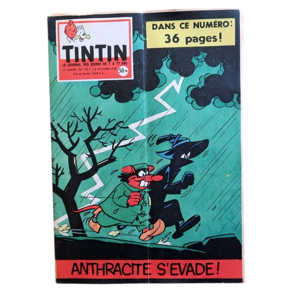 Front cover of Journal Tintin N°521 from October 16, 1958, featuring an energetic illustration of two cartoon characters – a red-nosed figure in a flapping green coat and a sleek black villain – sprinting through a stormy teal night with a jagged lightning bolt splitting the sky behind them, announcing the story "Anthracite S'Evade!"

