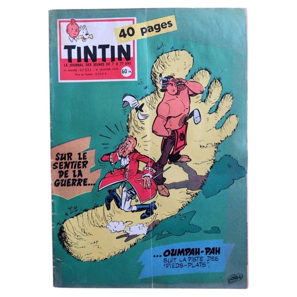 Front cover of Journal Tintin N°531 from January 8, 1959, featuring a riotously comic signed illustration by Albert Uderzo depicting a colossal yellow furry foot of Oumpah-Pah sending a French colonial officer spinning through the air against a bold teal-green background, with the caption "Sur le sentier de la guerre… Oumpah-Pah suit la piste des 'Pieds-Plats'!"

