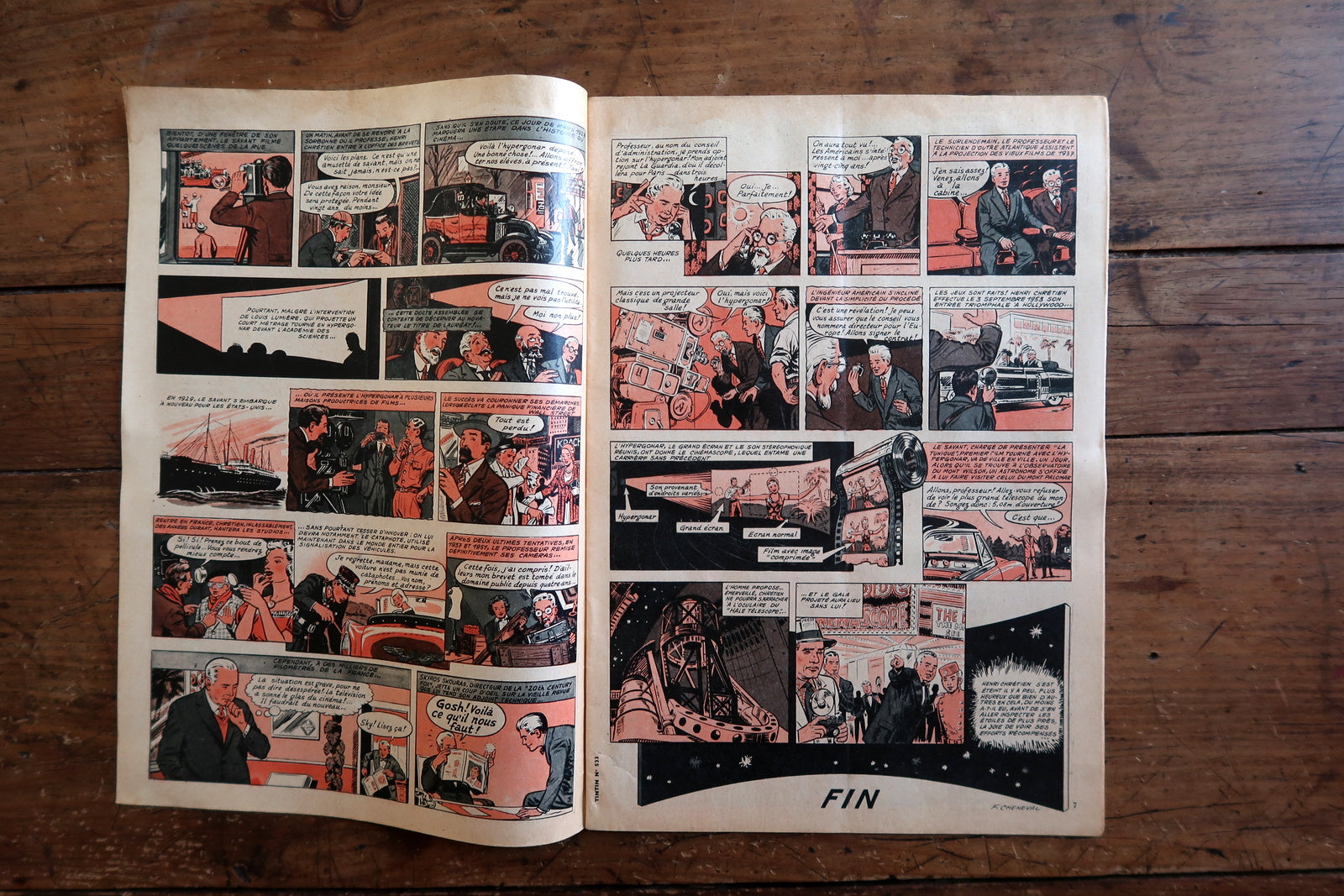 Back cover of a 1959 Tintin comic magazine showing a full-page color episode of Tintin au Tibet by Hergé – Tintin and Captain Haddock in a bustling Nepalese market, rendered in immaculate ligne claire with warm ochres and reds against cool Himalayan blue, culminating in a dramatic "AU FEU!"

