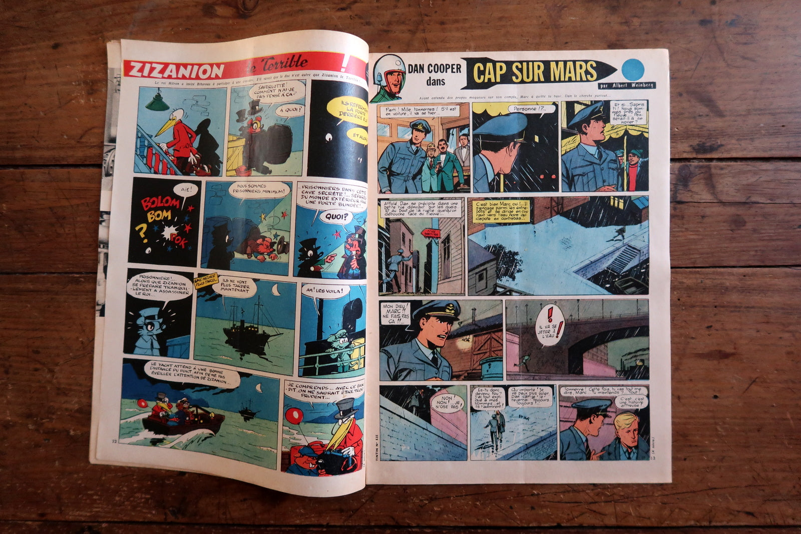 Open view of original Tintin magazine N°535 showing interior pages including Albert Weinberg's Dan Cooper dans "Cap sur Mars" (full double-page color aviation thriller), Zizanion le Terrible (nocturnal submarine adventure), and La Griffe Noire (ancient sea battle double-page spread).


