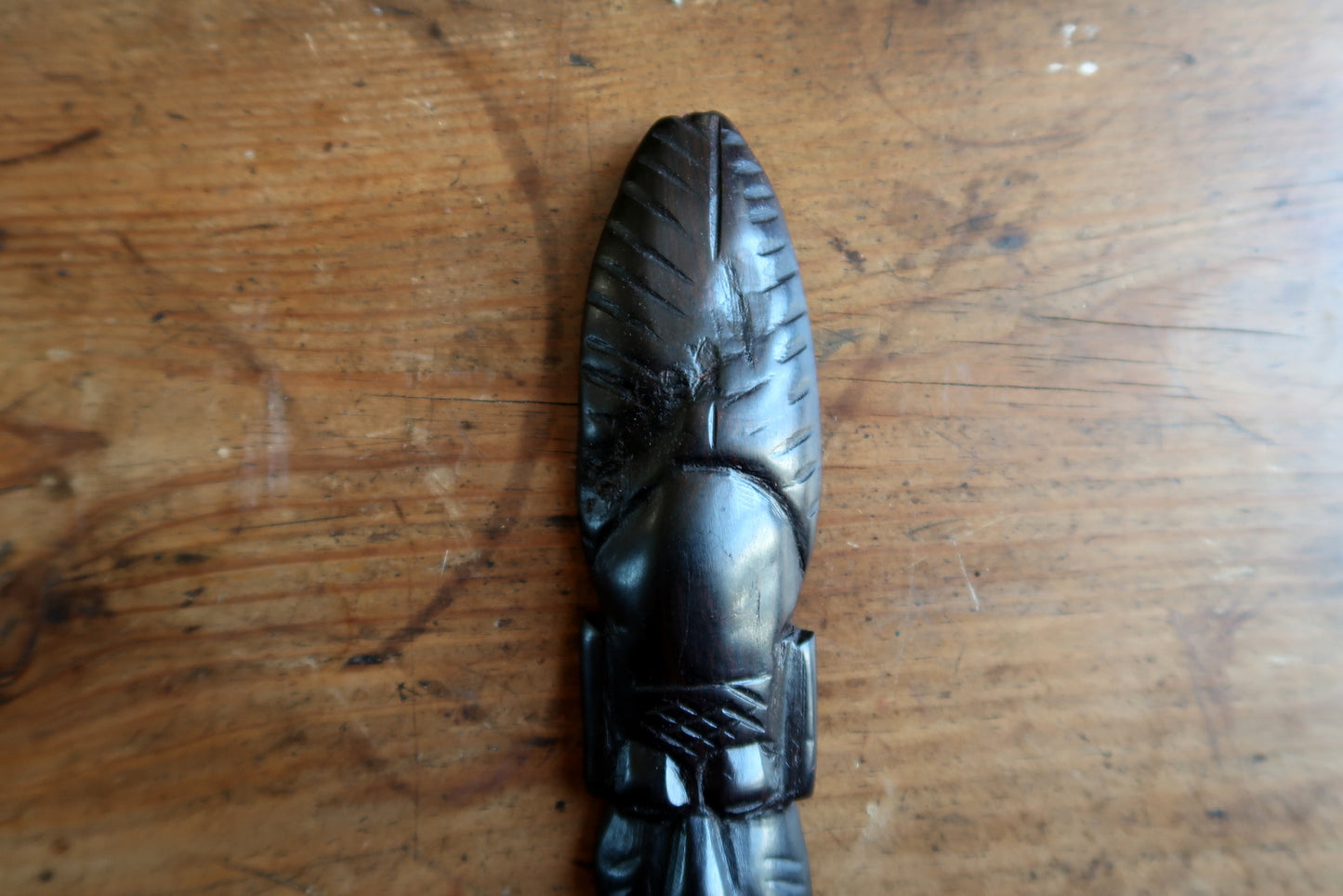 African ceremonial mask — hand‑carved with textured leaf crest and smooth patina

