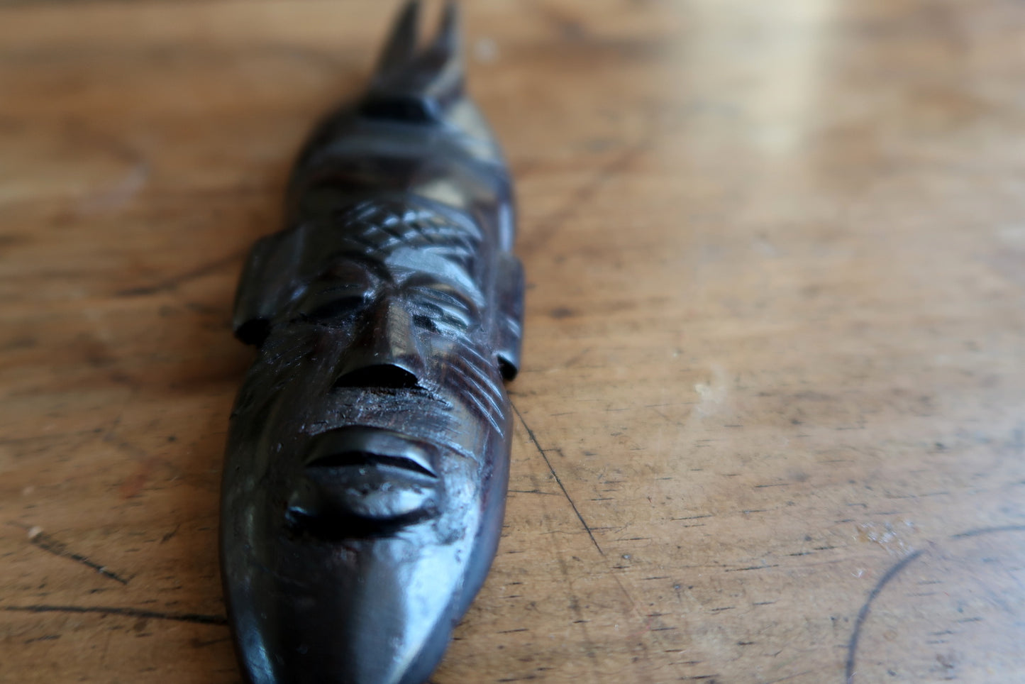 Vintage African mask — strong facial expression and twin‑prong headdress

