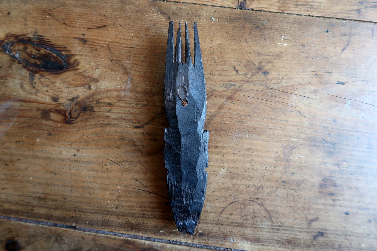 West African tribal mask — refined facial carving and tall four‑prong headdress

