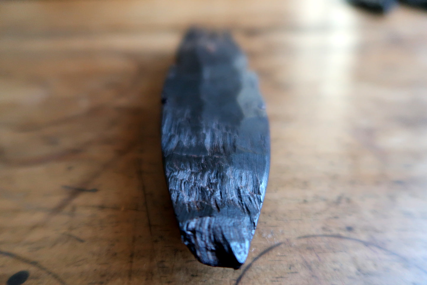 Ebonized tribal mask — smooth patina mask with sculpted four‑prong crown

