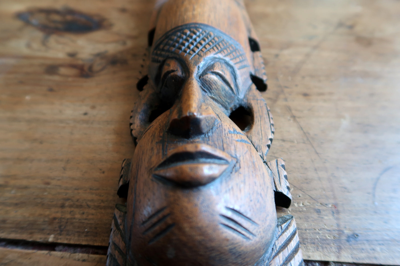 Hand‑carved African mask — artisan hardwood mask with raised crown crest

