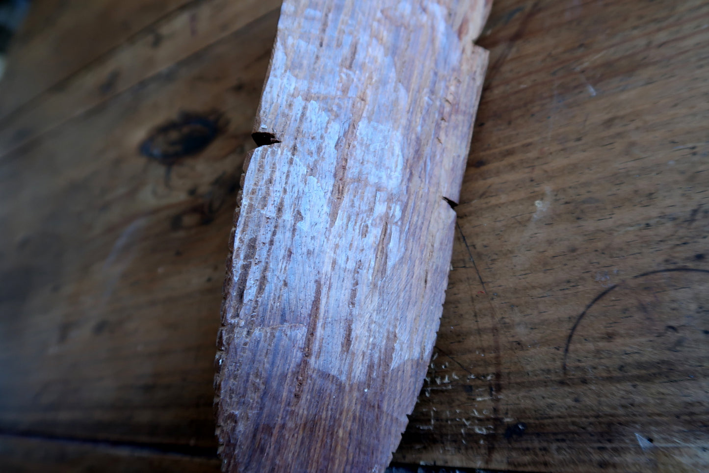 African hardwood face mask — smooth carved surface and stylized facial lines

