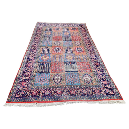 Handmade antique Persian Kazvin rug with a garden panel design.

