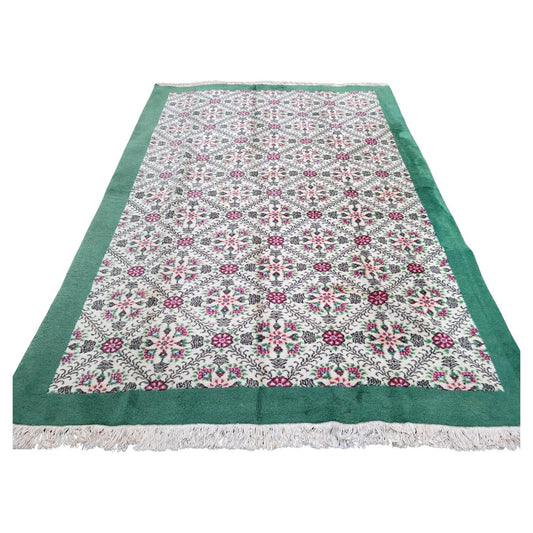 Handmade vintage Turkish Sivas rug with floral lattice design.

