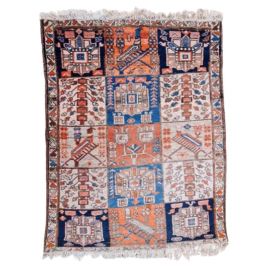 Handmade vintage Persian Bakhtiari rug with a garden panel design.
