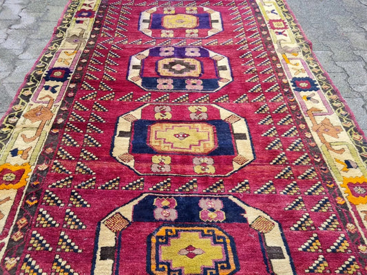 Close-up of geometric medallion in navy and yellow

