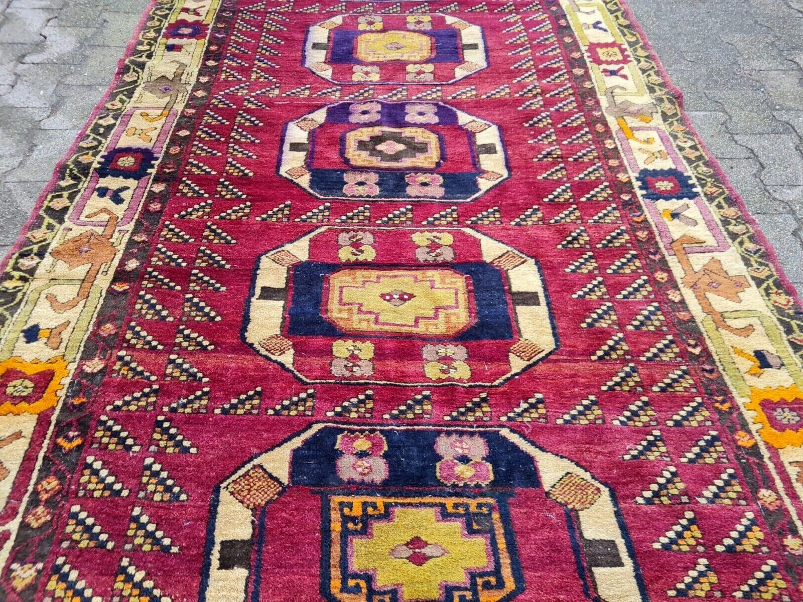 Cream and beige border on Anatolian wool rug

