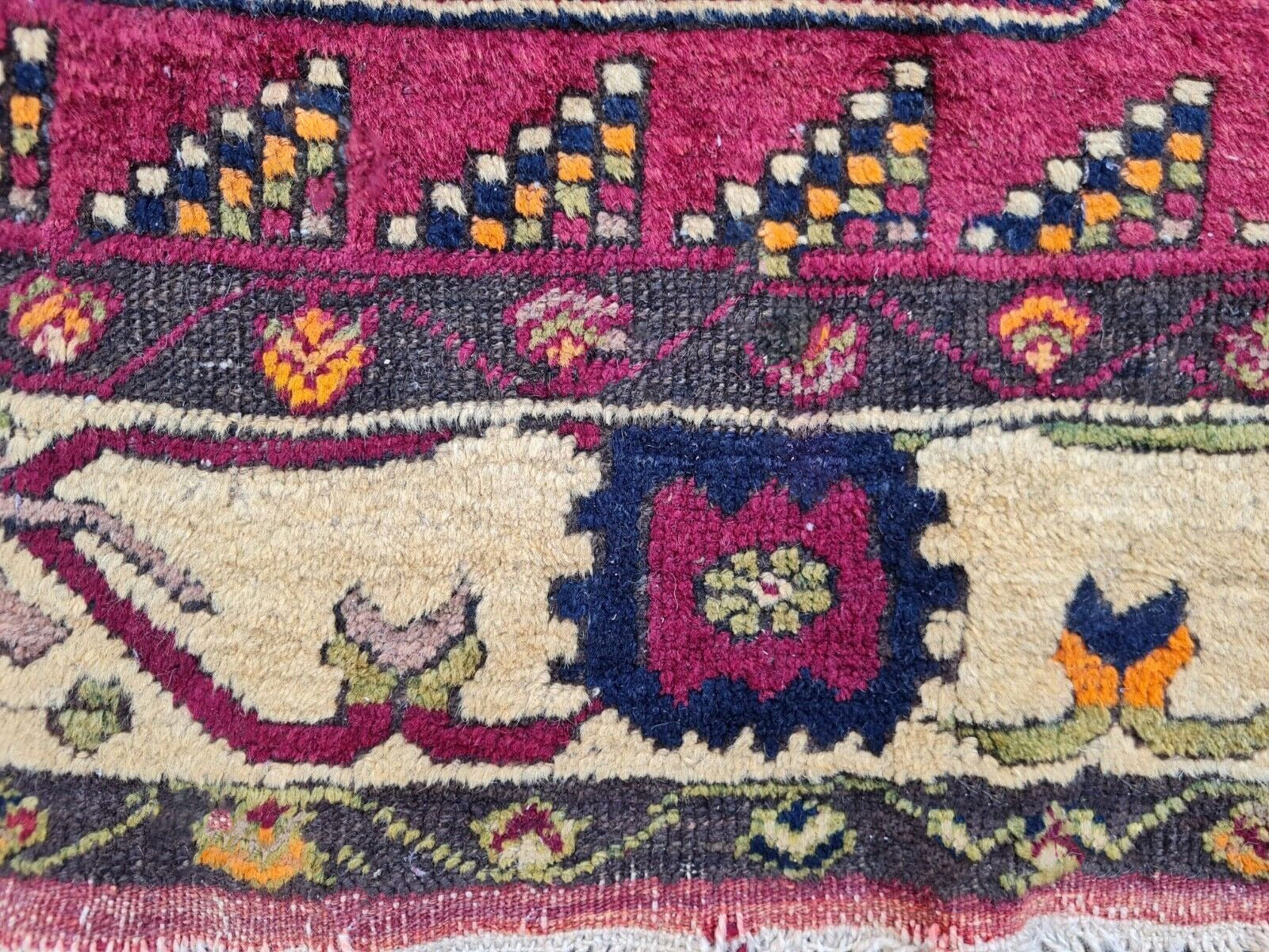 Hand-knotted wool texture of 1930s rug

