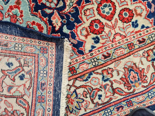 Central medallion in red and light blue on 1920s rug

