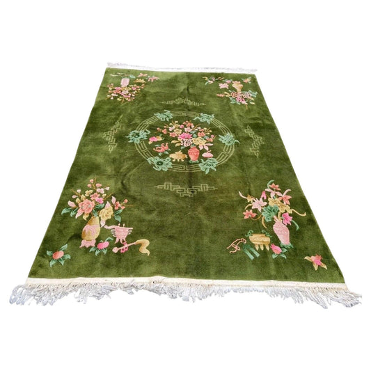 Vintage Art Deco Chinese rug with green background and floral vases

