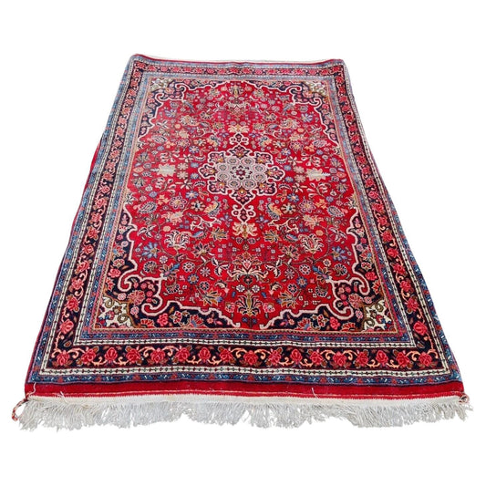 Vintage Persian Bidjar rug with red field and central medallion

