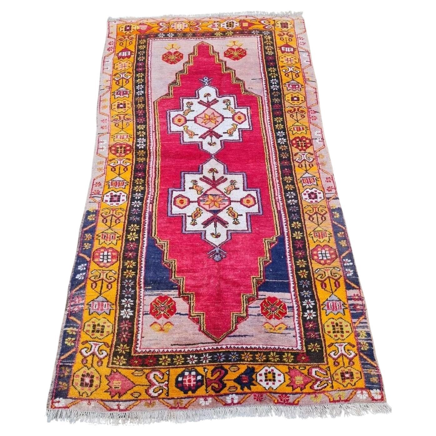 close-up of geometric medallion on antique Anatolian rug