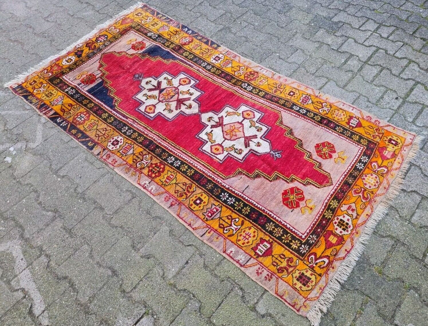 Anatolian rug border with stylized geometric flowers