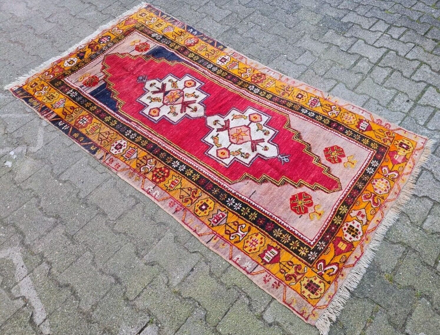 Anatolian rug border with stylized geometric flowers