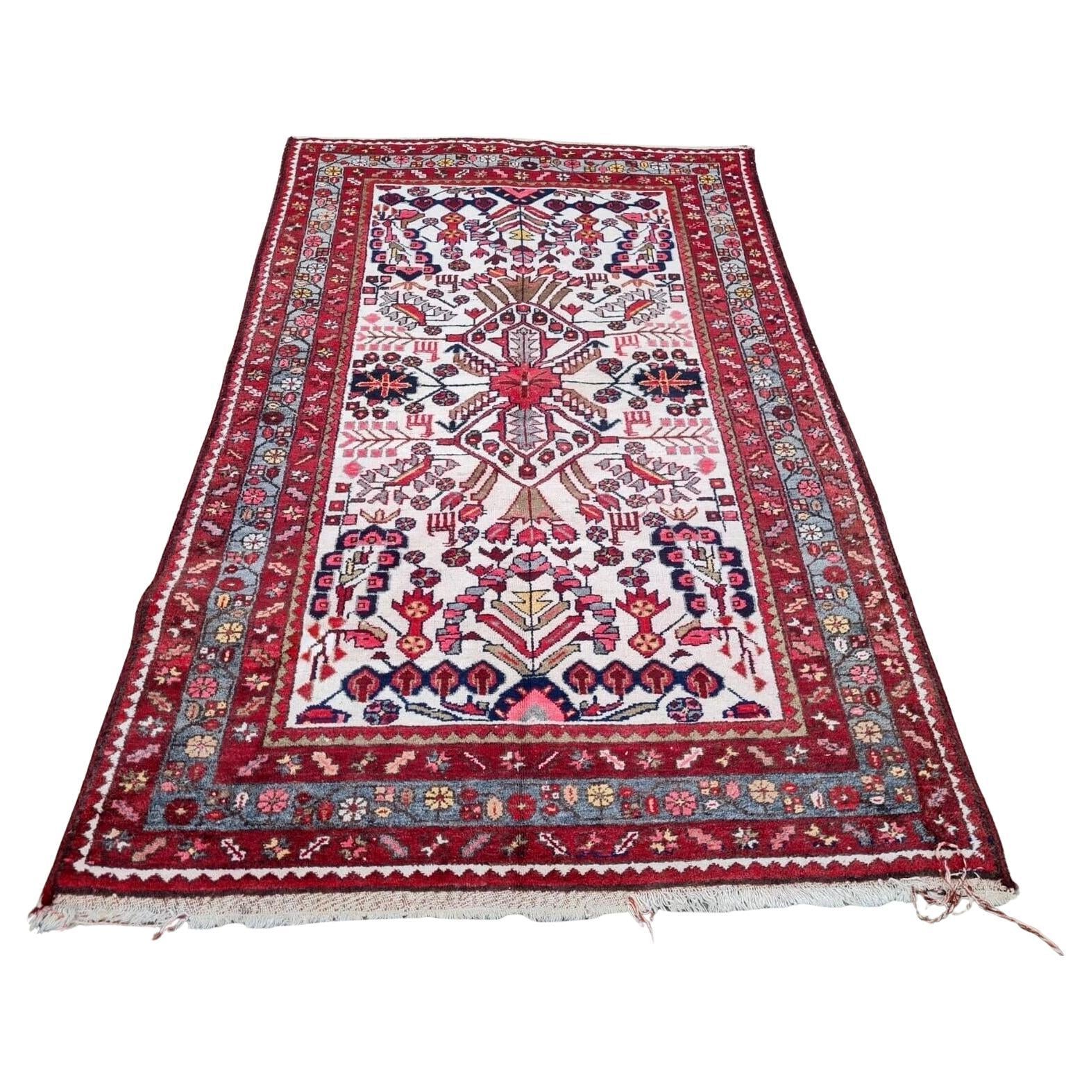handmade antique Persian Hamadan rug with bold red field
